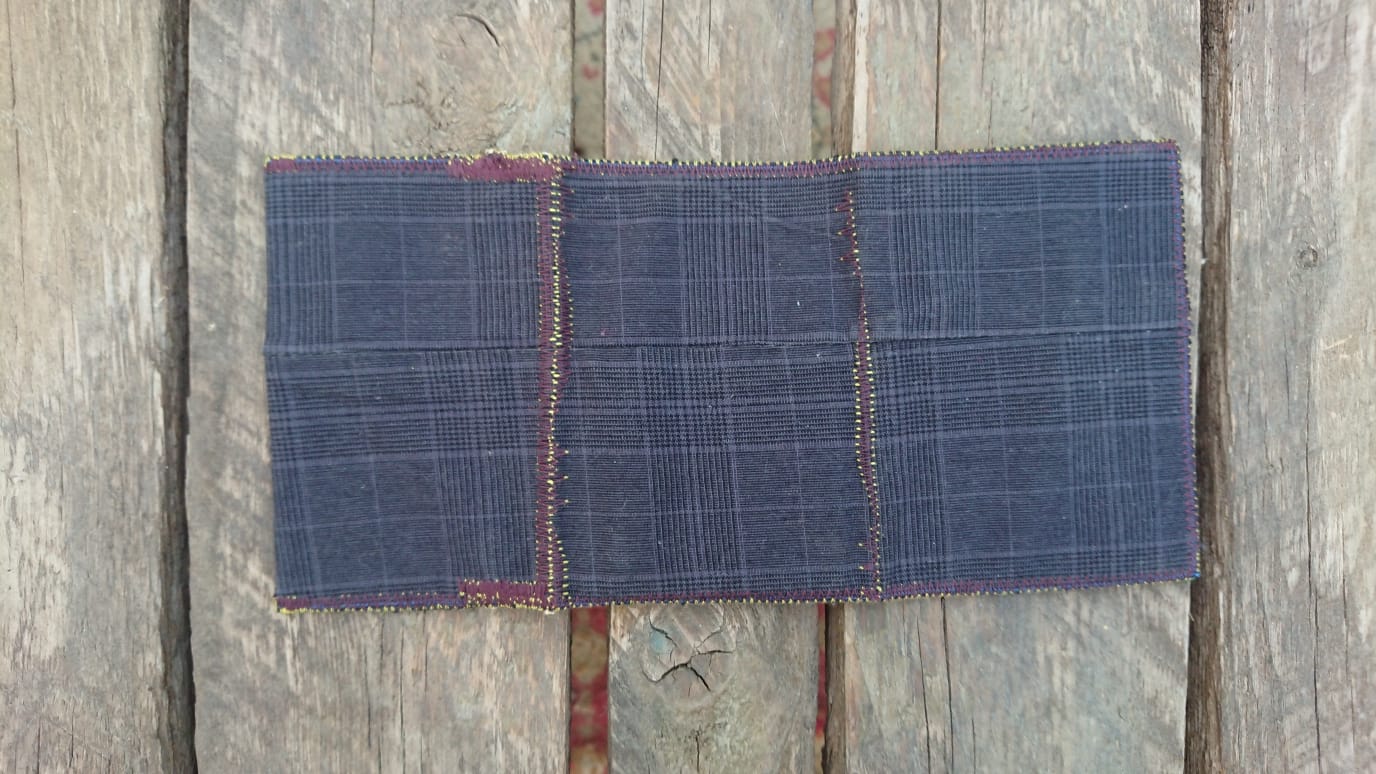 A one-of-a-kind wallet called "Fare And Square" is made by Highsew. It is made of recycled old pants fabric combined with new, strong fabric. Outside view.