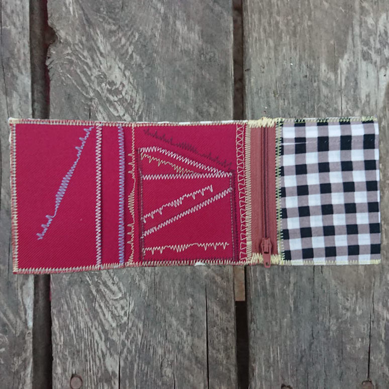 A one-of-a-kind wallet called "Black, Grey and White" is made by Highsew. It is made of recycled shirt fabric combined with new, strong fabric. Inside view.