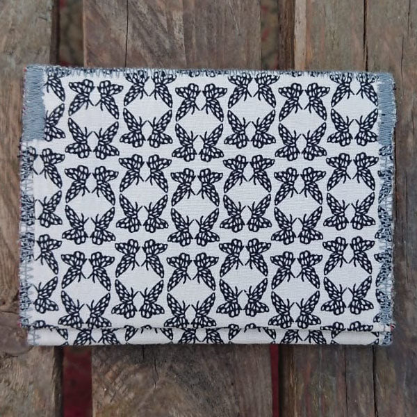 A one-of-a-kind wallet called "Butterflies Holding Hands" is made by Highsew. It is made of recycled shirt fabric combined with new, strong fabric. foldable.