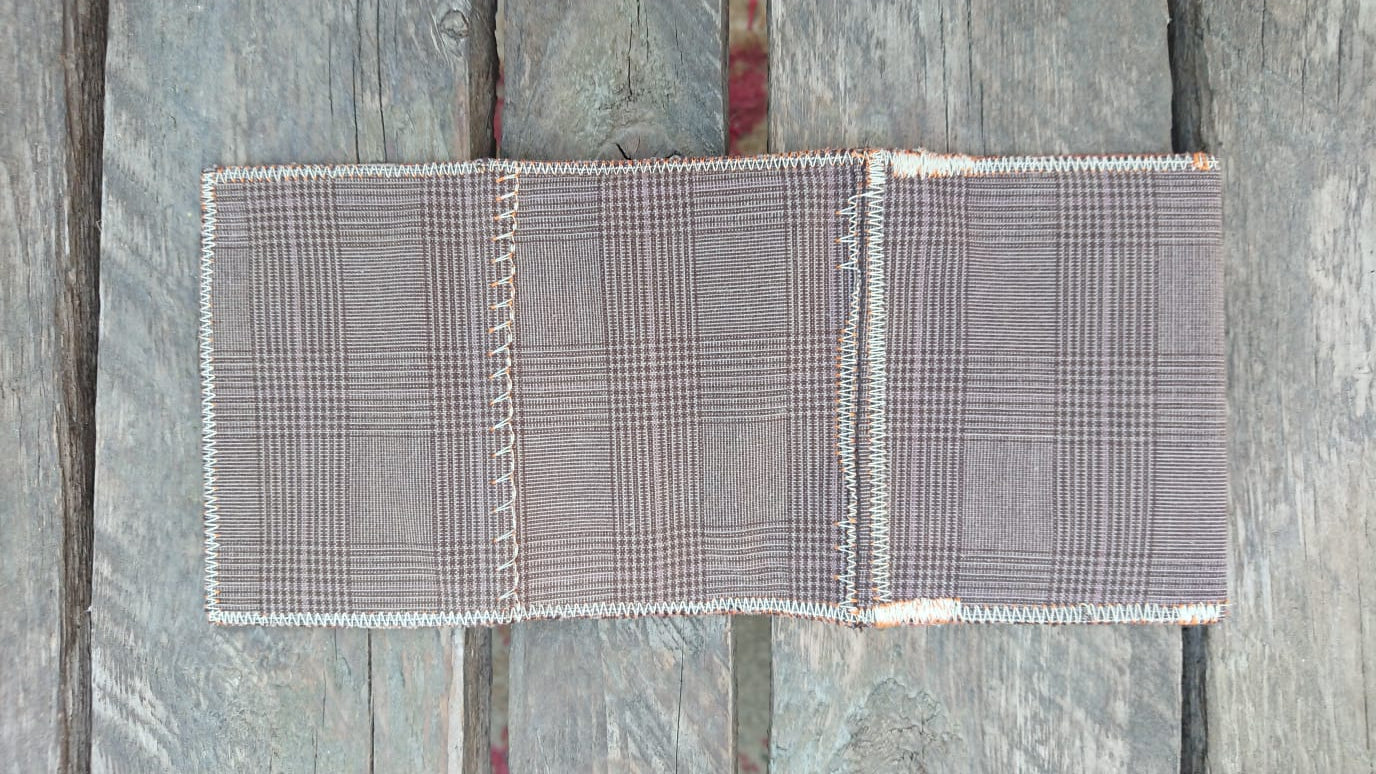 A one-of-a-kind wallet called "Drink & Evening" is made by Highsew. It is made of recycled old pants fabric combined with new, strong fabric. Outside VIew.