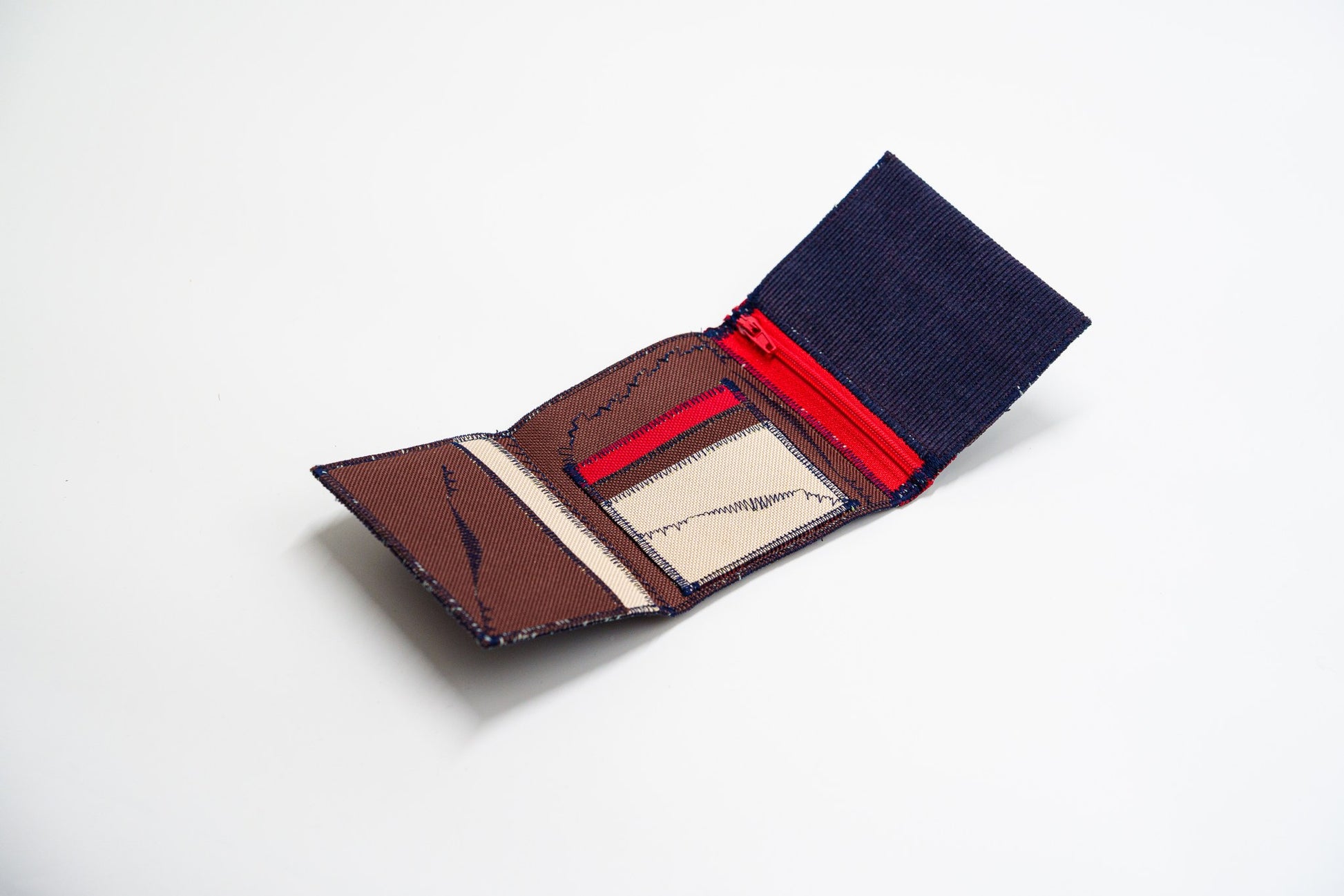 Open corduroy wallet interior in warm brown Cordura with red and sand card slots and red zip — HighSew
