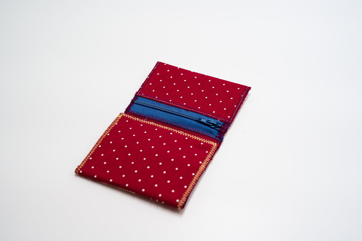 Polka-dot wallet interior with blue zip pocket — HighSew