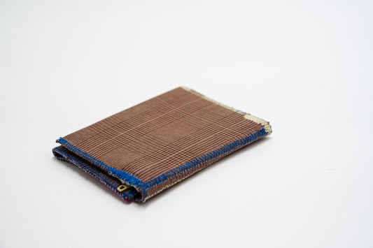 Brown glen-plaid wallet closed at an angle, handmade from upcycled trousers — HighSew