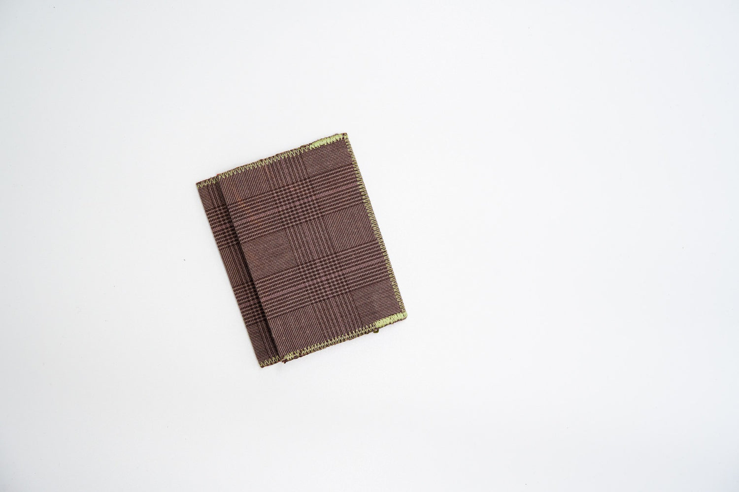 Brown glen-plaid wallet closed at an angle, handmade from upcycled trousers — HighSew