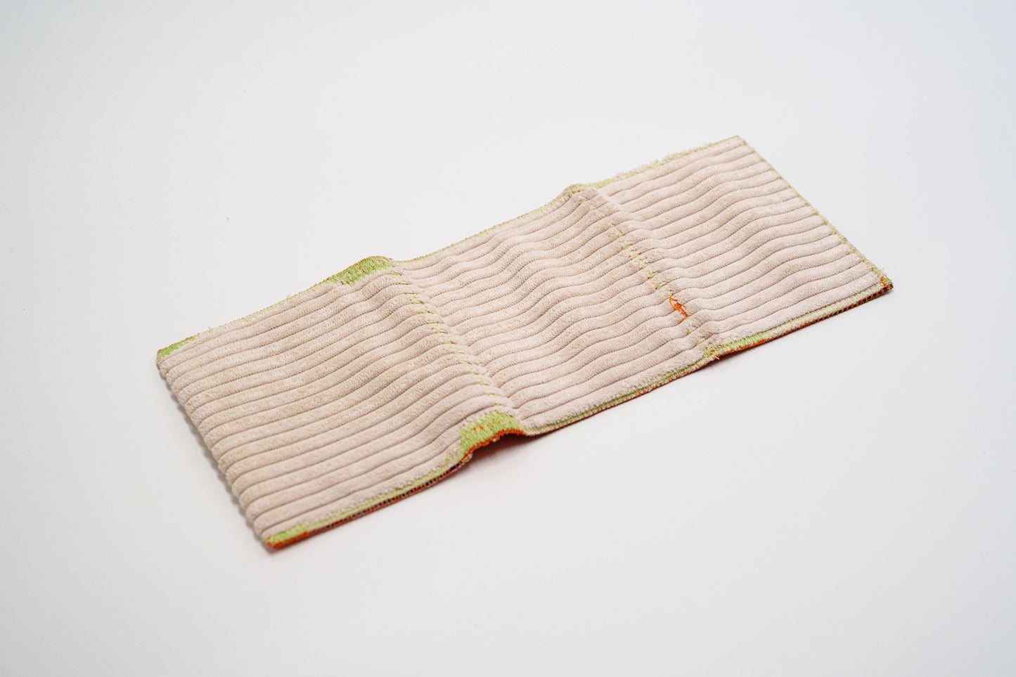 Ribbed cream upholstery-fabric exterior of one-of-a-kind upcycled wallet — HighSew