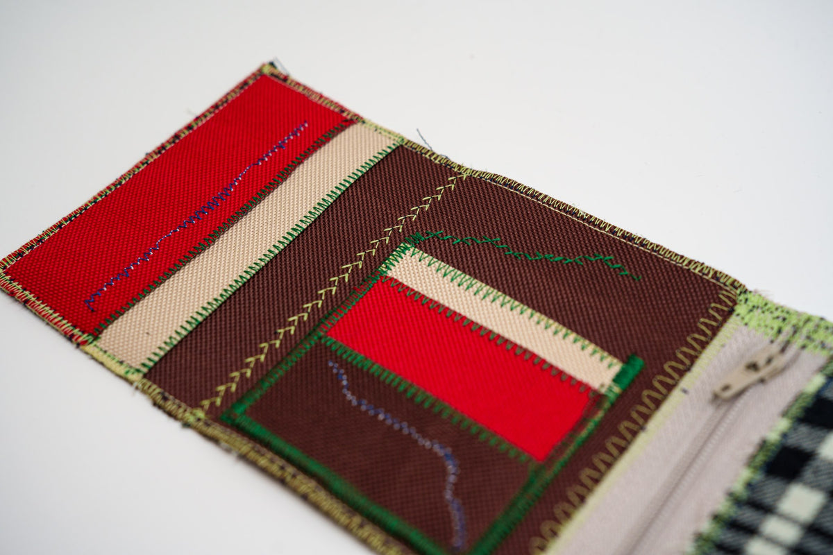 Close-up of red and brown wallet interior with zigzag stitching, from an upcycled flannel shirt — HighSew